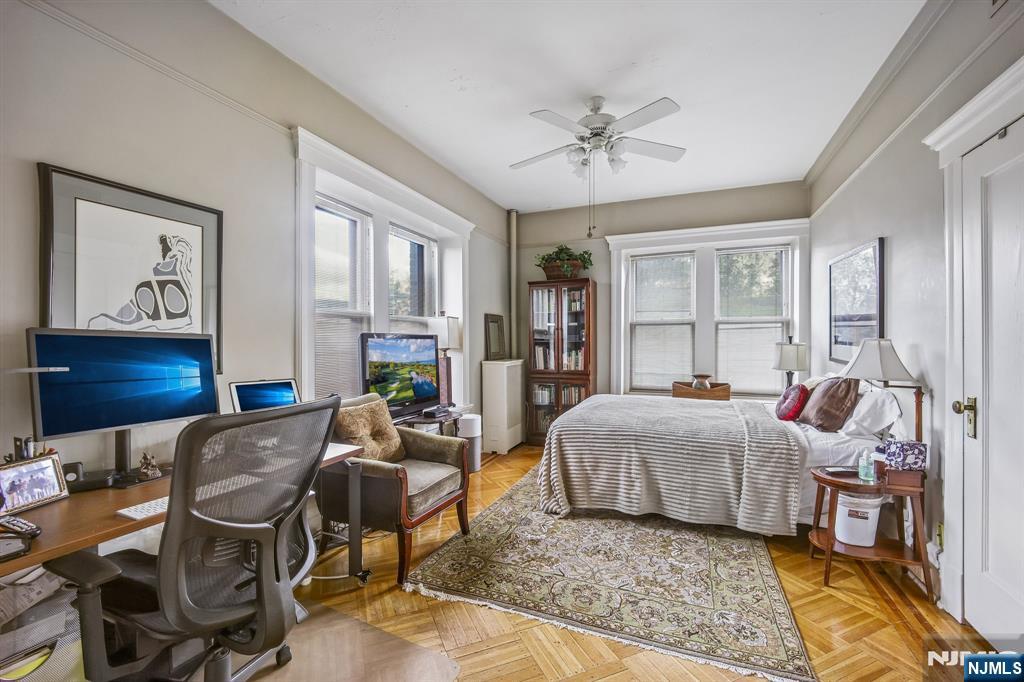 57 Union Street, Unit C4021 Montclair, NJ 07042 - Photo 15 of 20 a bedroom with a bed and wooden floor