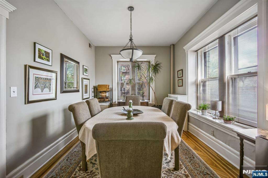 57 Union Street, Unit C4021 Montclair, NJ 07042 - Photo 7 of 20 a living room with furniture and a chandelier