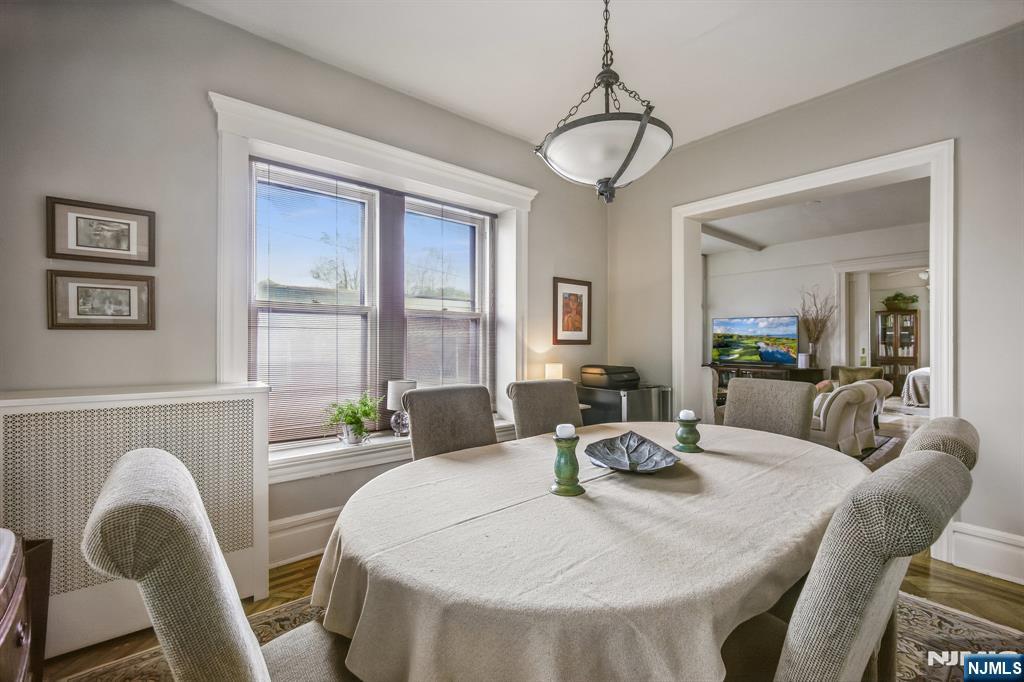 57 Union Street, Unit C4021 Montclair, NJ 07042 - Photo 9 of 20 a dining room with furniture a chandelier and window