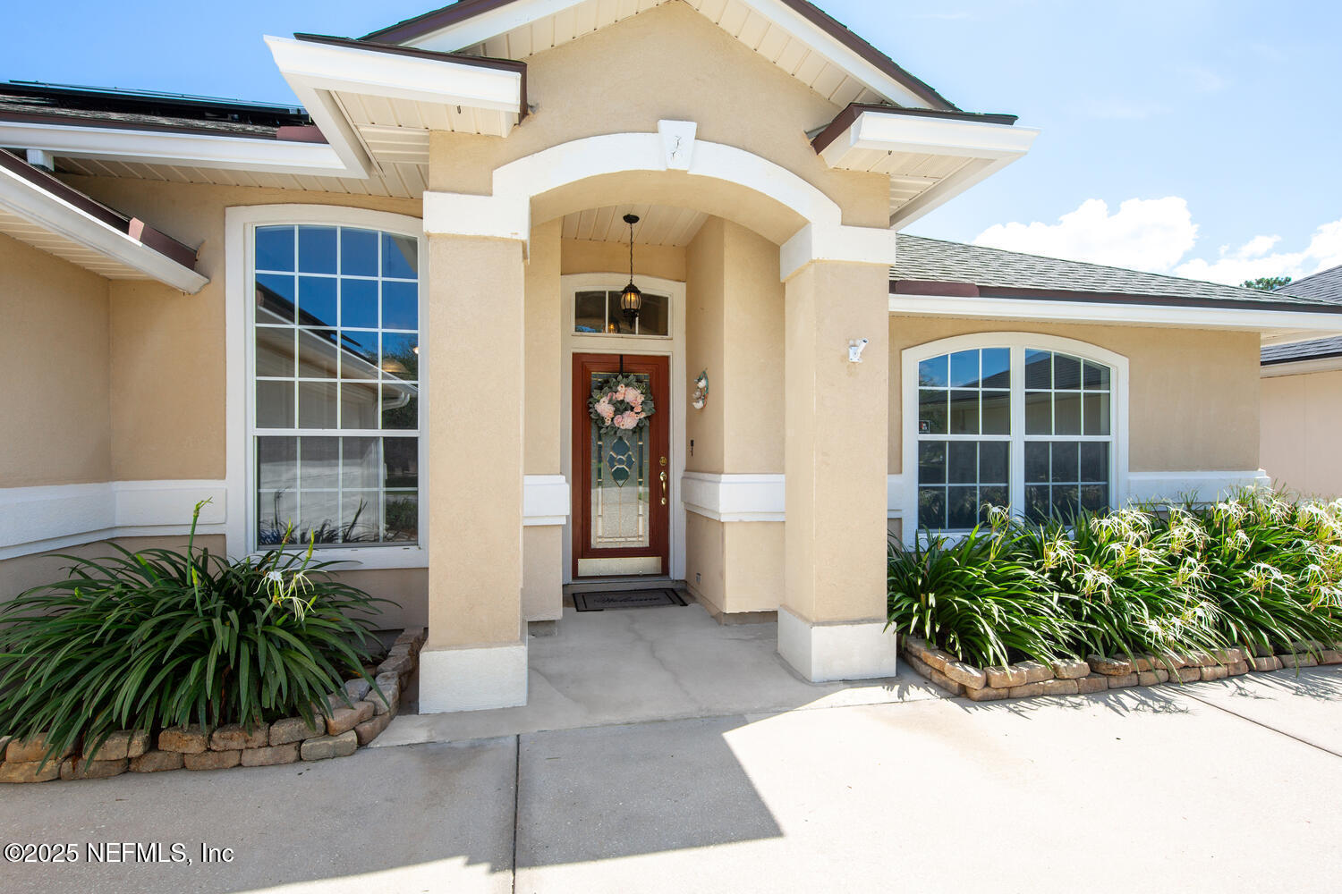 9317 Beresford Court Jacksonville, FL 32244 - Photo 1 of 55 a front view of a house with a glass door