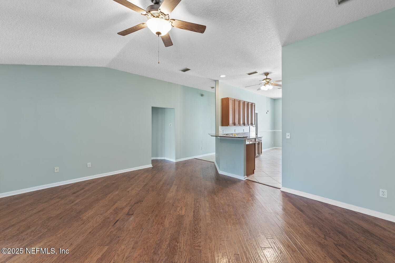 9317 Beresford Court Jacksonville, FL 32244 - Photo 14 of 55 wooden floor in an empty room with a window