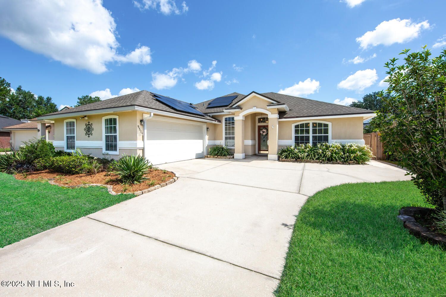 9317 Beresford Court Jacksonville, FL 32244 - Photo 2 of 55 a front view of a house with a yard