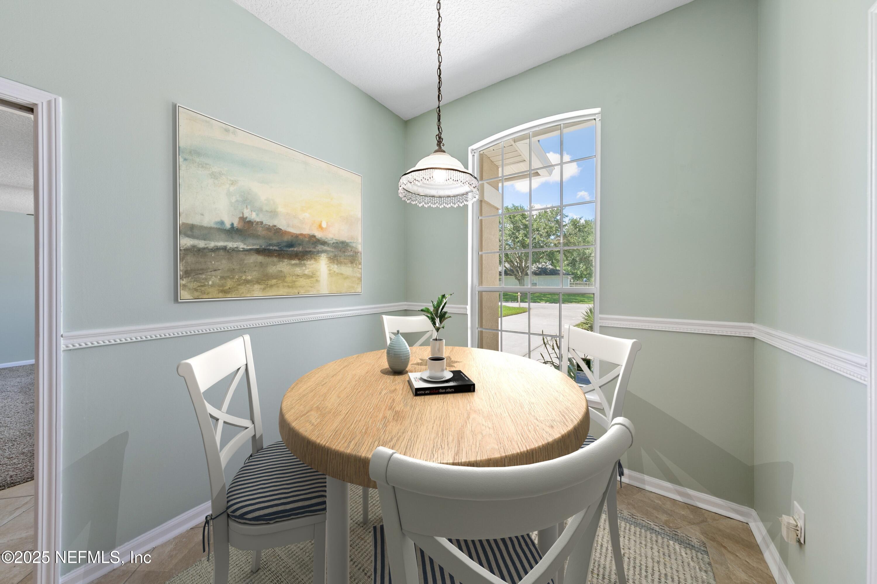 9317 Beresford Court Jacksonville, FL 32244 - Photo 21 of 55 a dining room with furniture and window