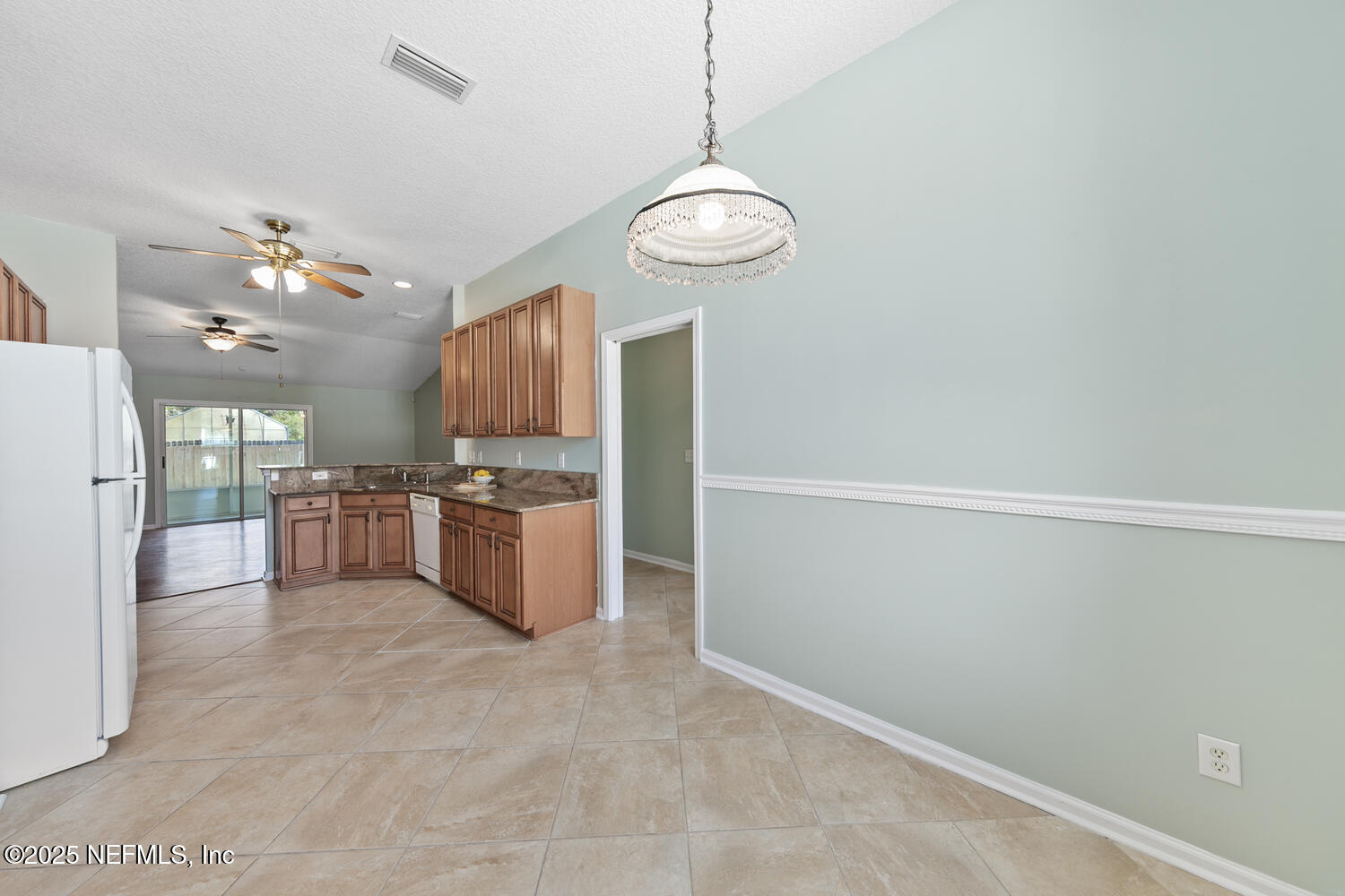 9317 Beresford Court Jacksonville, FL 32244 - Photo 22 of 55 a large kitchen with a refrigerator and a stove