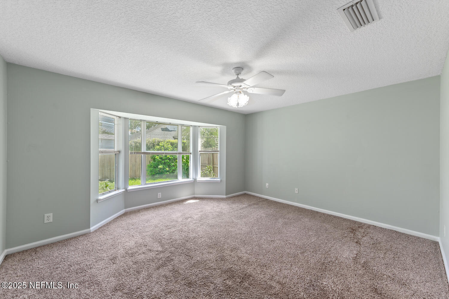 9317 Beresford Court Jacksonville, FL 32244 - Photo 25 of 55 a view of an empty room with a window