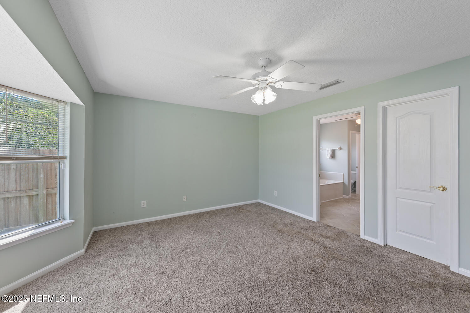 9317 Beresford Court Jacksonville, FL 32244 - Photo 27 of 55 a view of an empty room with a window