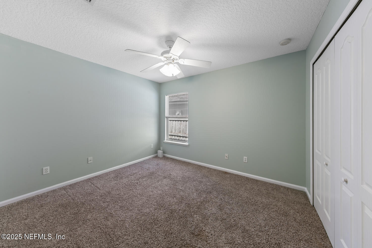 9317 Beresford Court Jacksonville, FL 32244 - Photo 32 of 55 a view of an empty room with a window