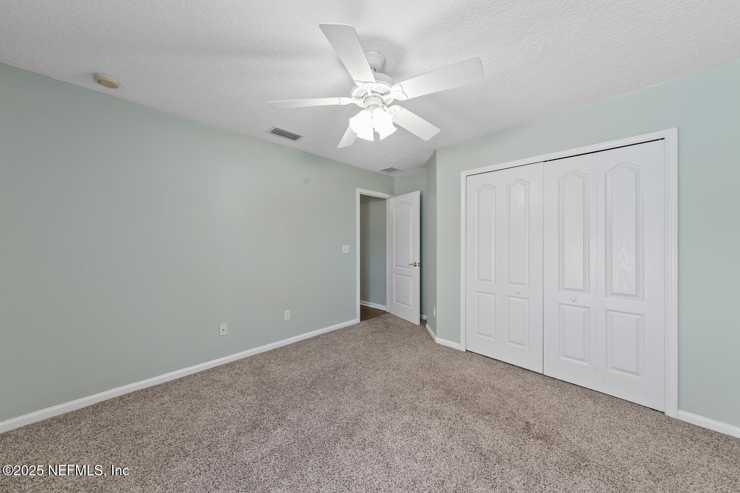 9317 Beresford Court Jacksonville, FL 32244 - Photo 36 of 55 a view of an empty room and chandelier fan