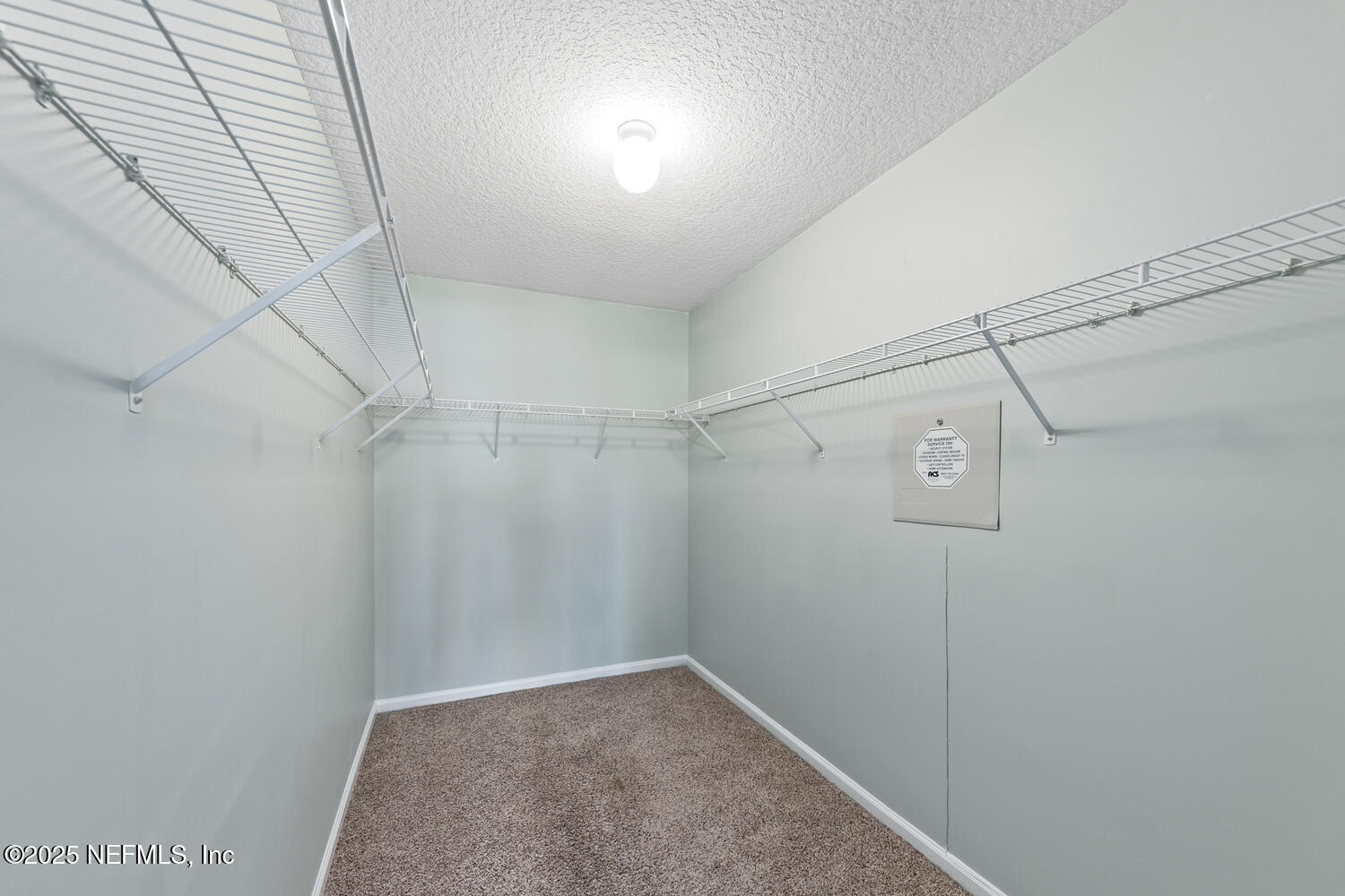 9317 Beresford Court Jacksonville, FL 32244 - Photo 38 of 55 a view of a walk in closet