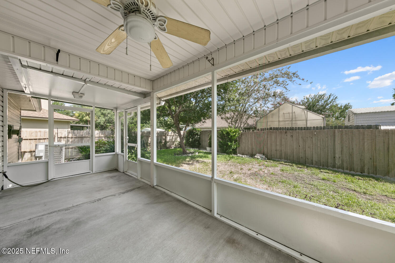 9317 Beresford Court Jacksonville, FL 32244 - Photo 40 of 55 a view of an empty room with wooden floor and iron stairs
