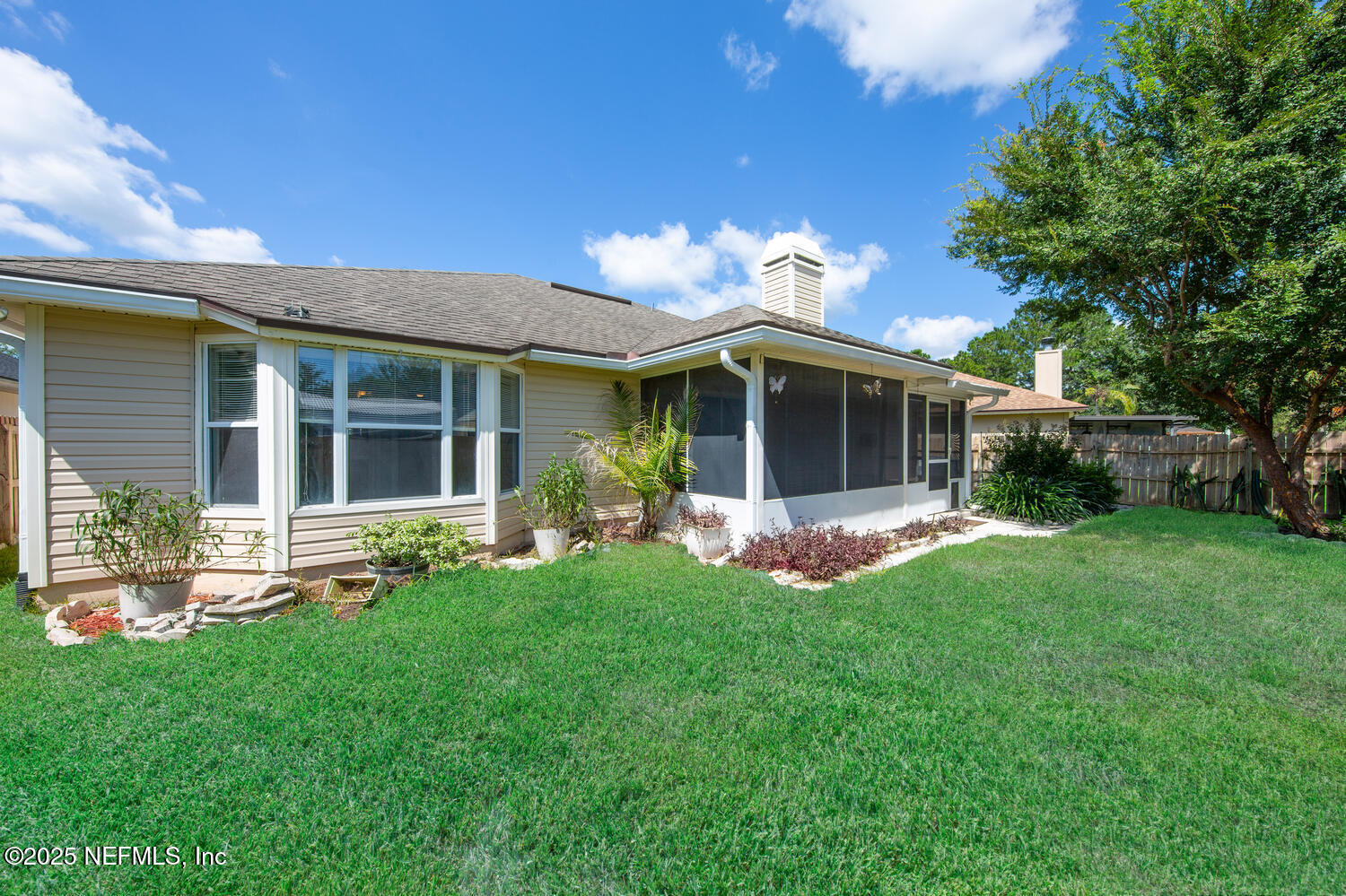 9317 Beresford Court Jacksonville, FL 32244 - Photo 42 of 55 a view of a house with a yard and a large tree