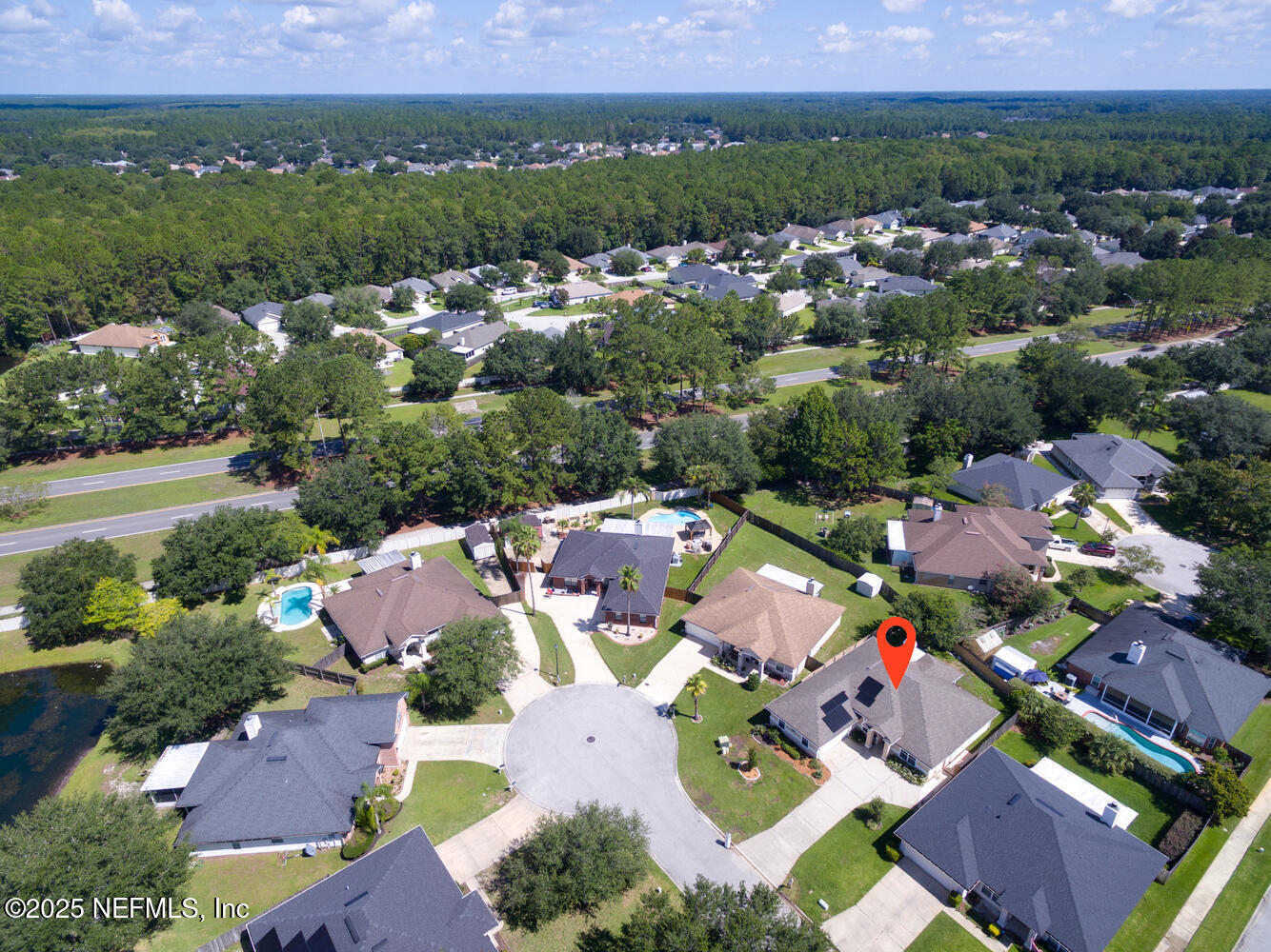 9317 Beresford Court Jacksonville, FL 32244 - Photo 46 of 55 an aerial view of residential houses with outdoor space and parking