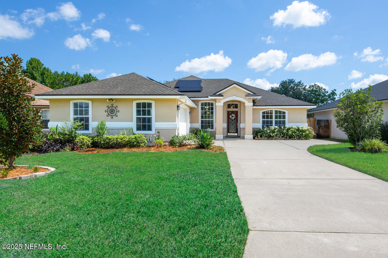 9317 Beresford Court Jacksonville, FL 32244 - Photo 48 of 55 a front view of house with yard and green space