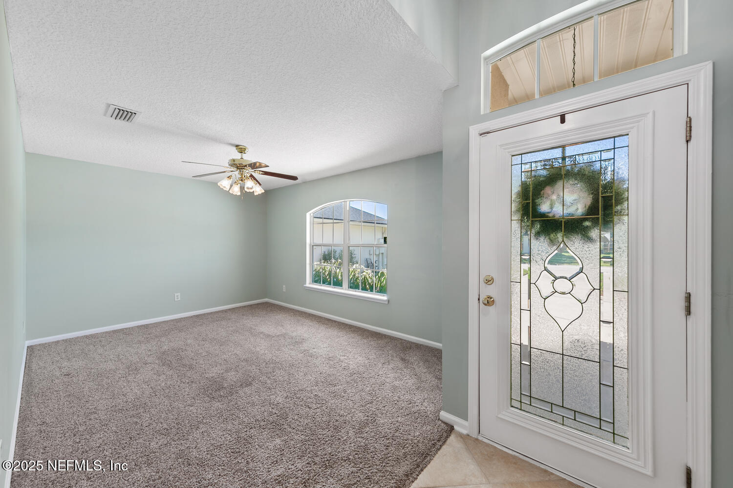 9317 Beresford Court Jacksonville, FL 32244 - Photo 6 of 55 an empty room with windows and mountain view