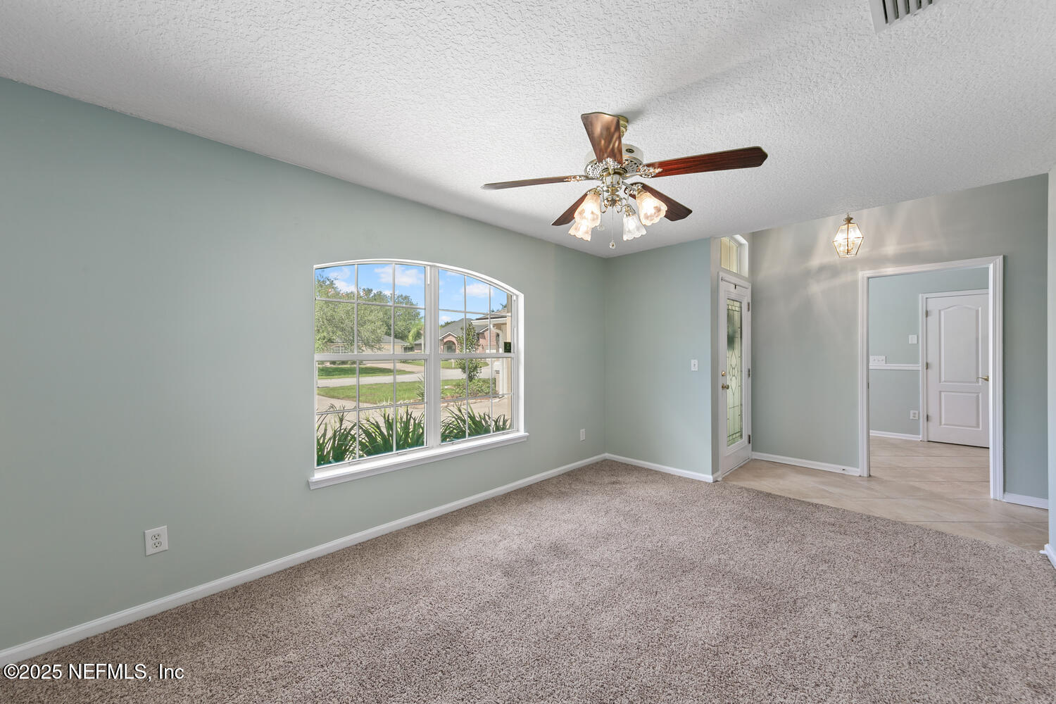 9317 Beresford Court Jacksonville, FL 32244 - Photo 8 of 55 an empty room with fan and windows