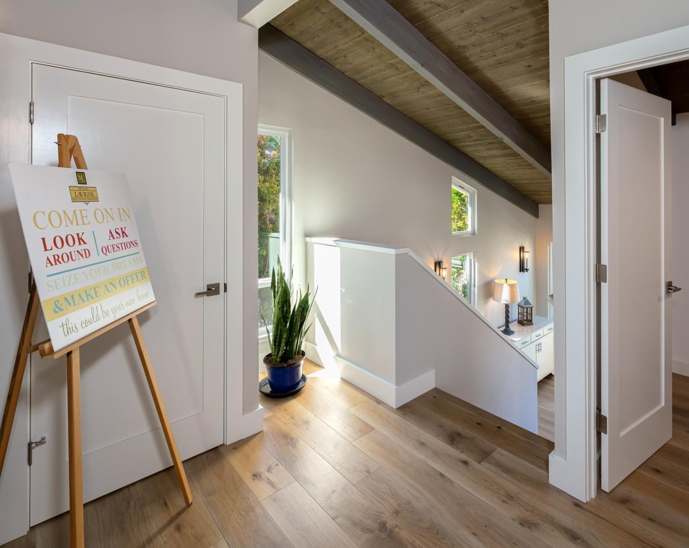 150 Vía Soderini Aptos, CA 95003 - Photo 11 of 36 a view of hallway with stairs and wooden floor
