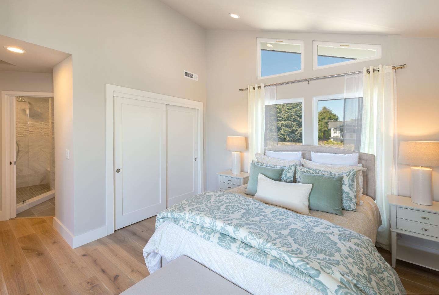 150 Vía Soderini Aptos, CA 95003 - Photo 22 of 36 a bedroom with a bed and a large window