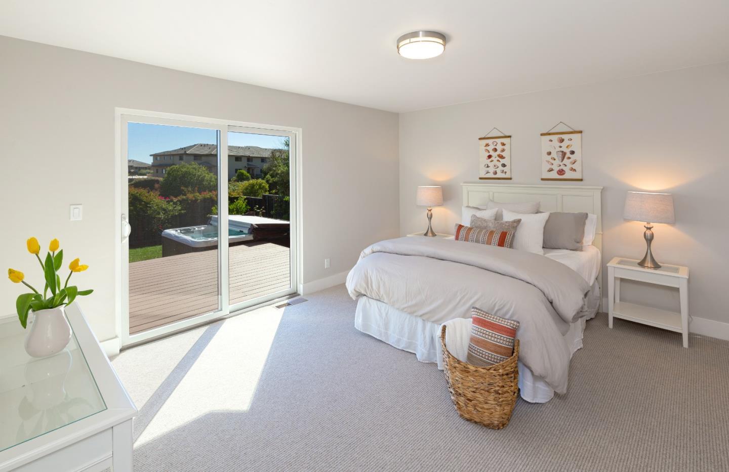 150 Vía Soderini Aptos, CA 95003 - Photo 24 of 36 a bedroom with a bed and glass window