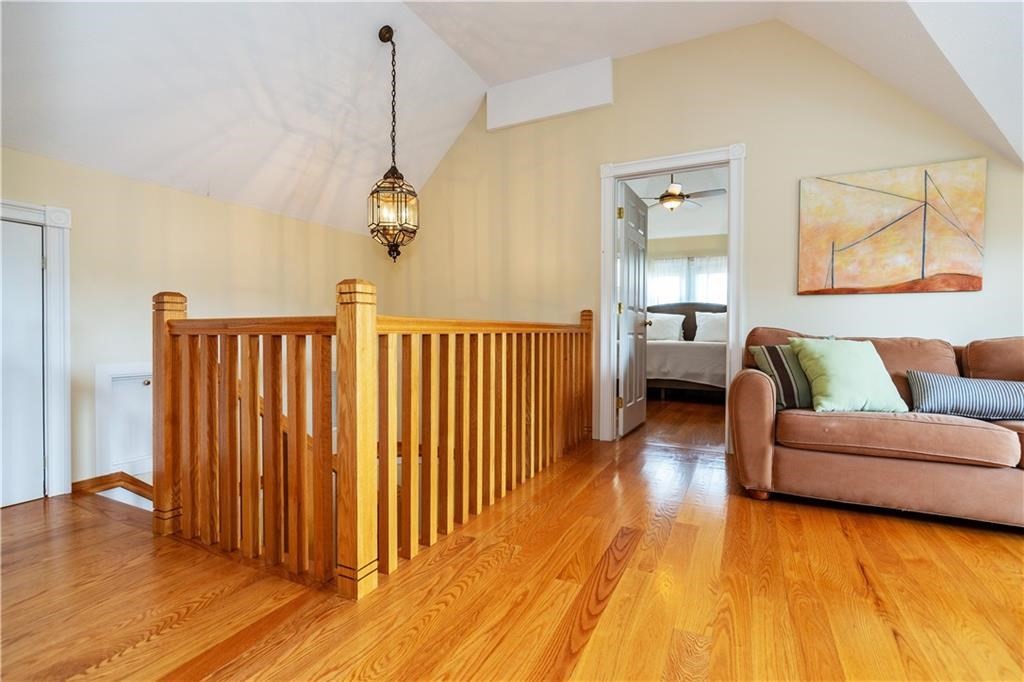 7 Gibson Avenue, Unit 7 Narragansett, RI 02882 - Photo 19 of 27 a living room with furniture and a wooden floor