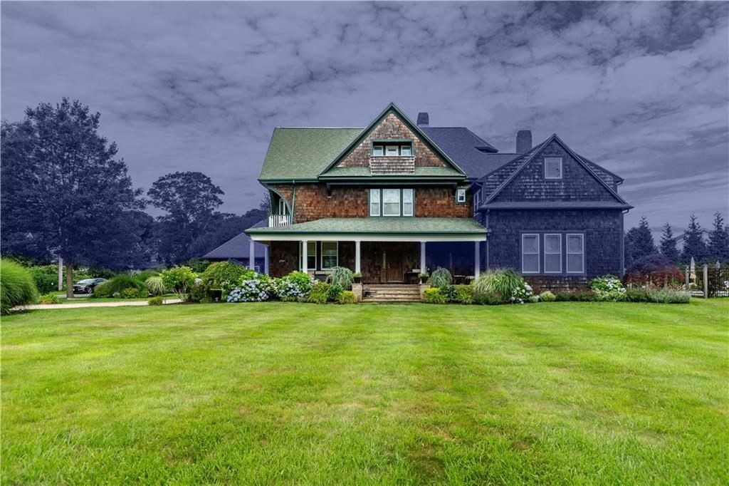 7 Gibson Avenue, Unit 7 Narragansett, RI 02882 - Photo 2 of 27 a front view of a house with garden