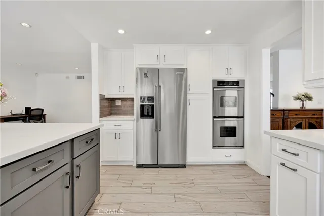 a bathroom with a granite countertop sink mirror and shower
