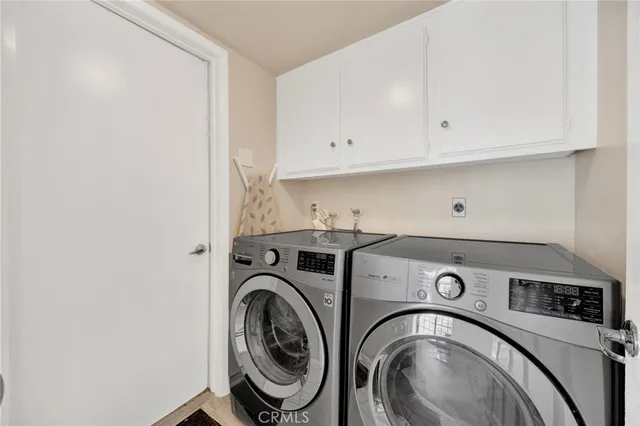 a bedroom with a bed and a potted plant