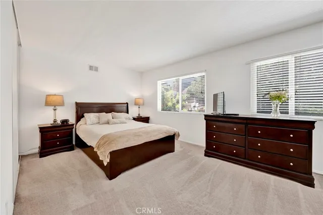 a view of a patio with table and chairs with wooden fence and plants