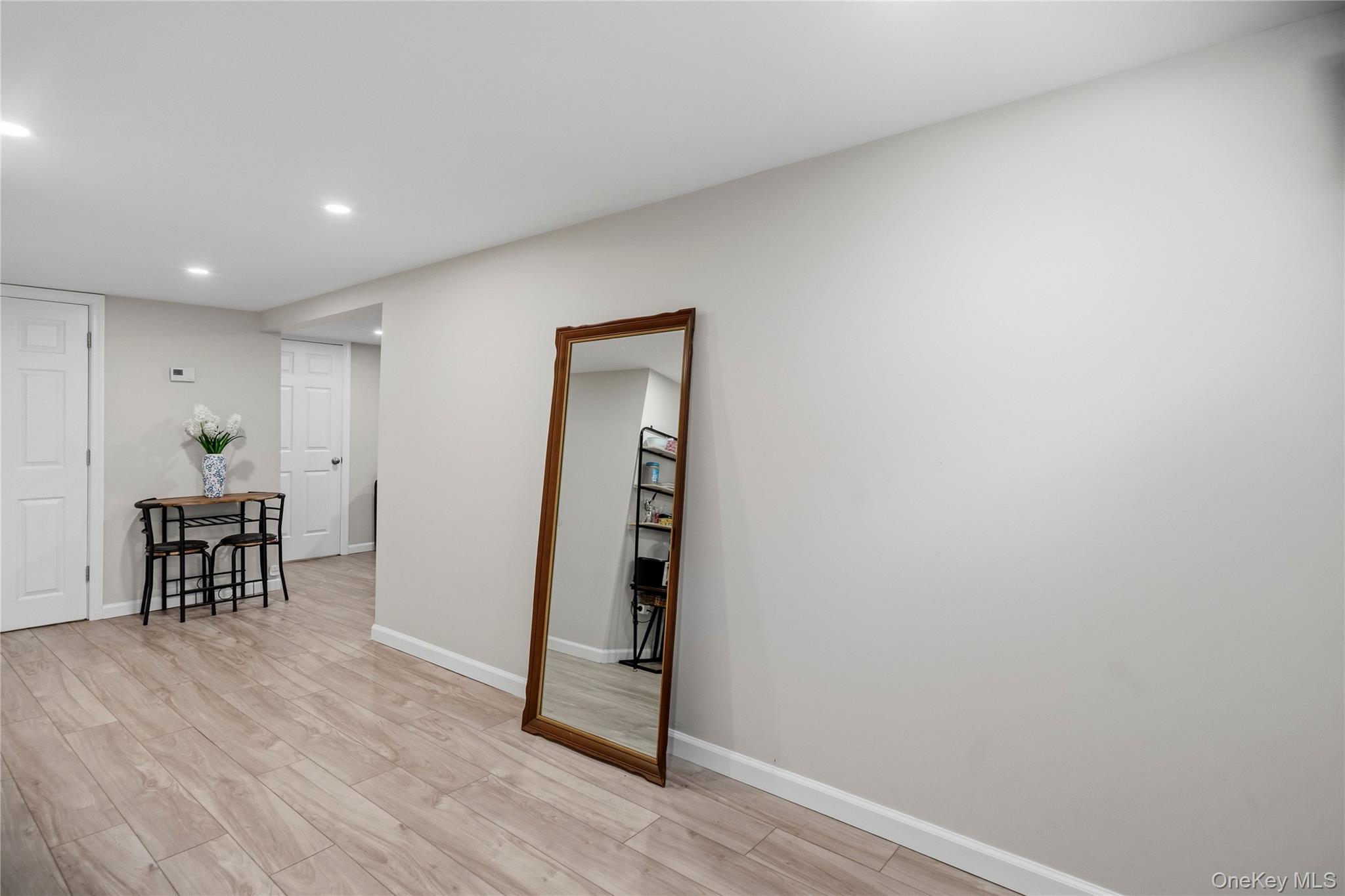 190 Sexton Road West Babylon, NY 11704 - Photo 22 of 28 a view of a hallway with wooden floor and furniture