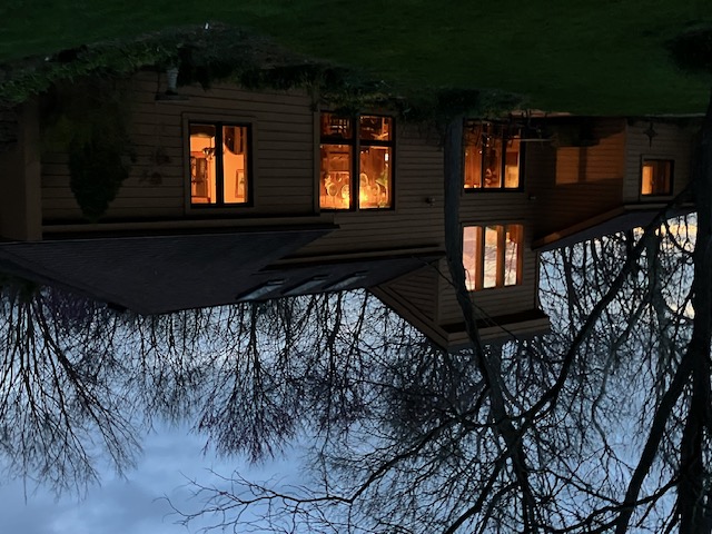 2066 Tolbert Road Hamilton, OH 45011 - Photo 57 of 63 This home glows with warmth against the evening sky, reflecting beautifully in the water below.