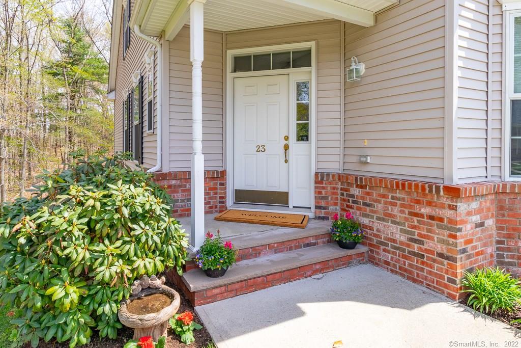 Welcome Spring in your new home. Covered entryway protects you from any inclement weather we may have living in CT. Glass panes above and on the side of your front door allows for natural sunlight to pour into your home.