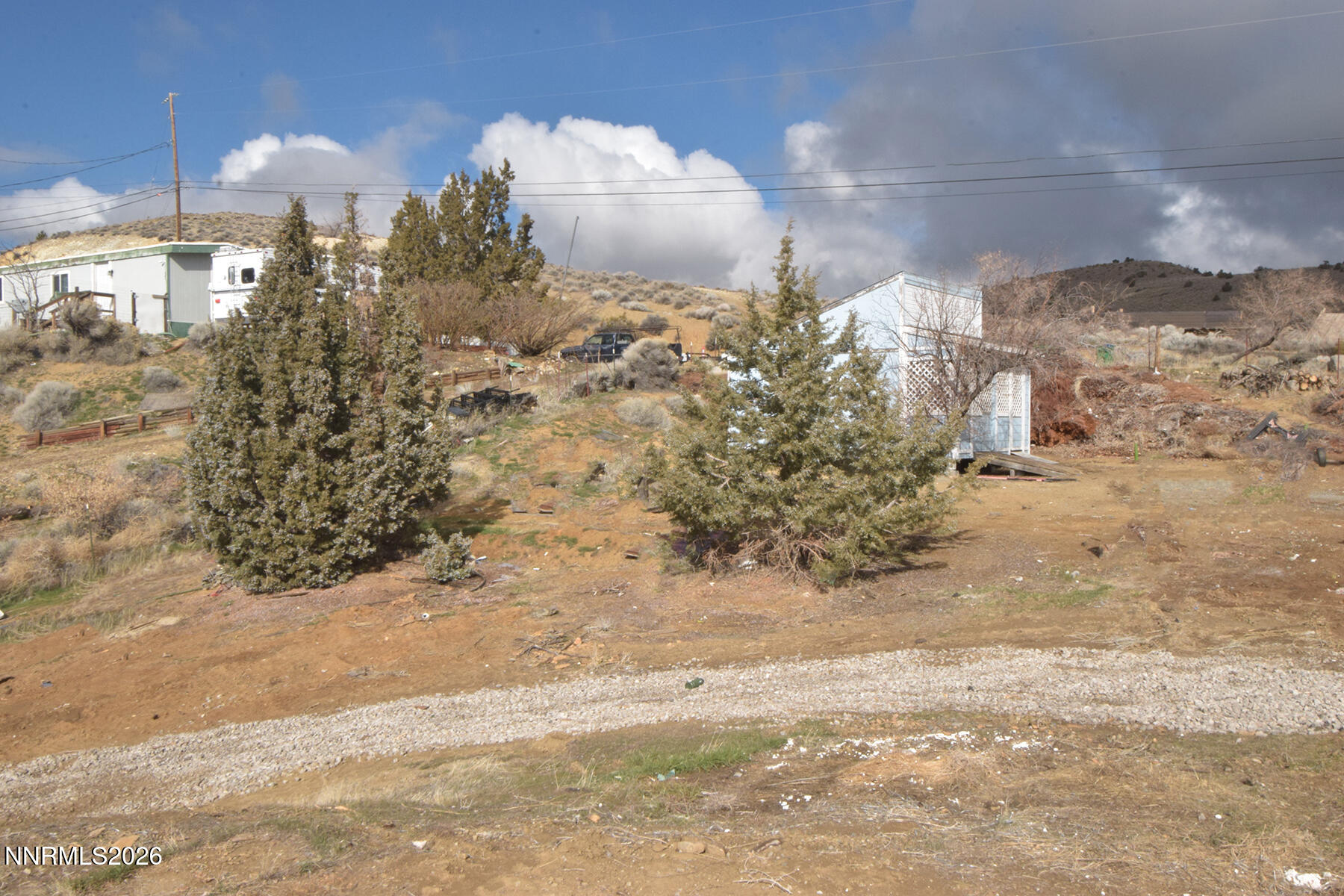 550 Quartz Lane Sun Valley, NV 89433 - Photo 27 of 31 a view of a fireplace in a yard