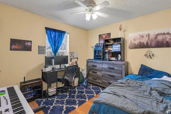 a bedroom with a bed and furniture