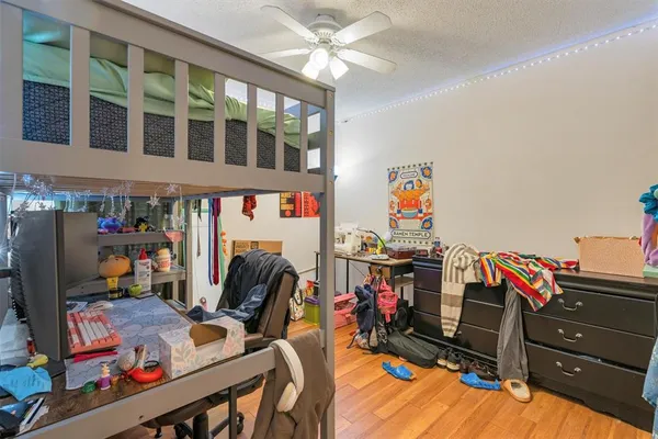 a storage room with furniture and a flat screen tv