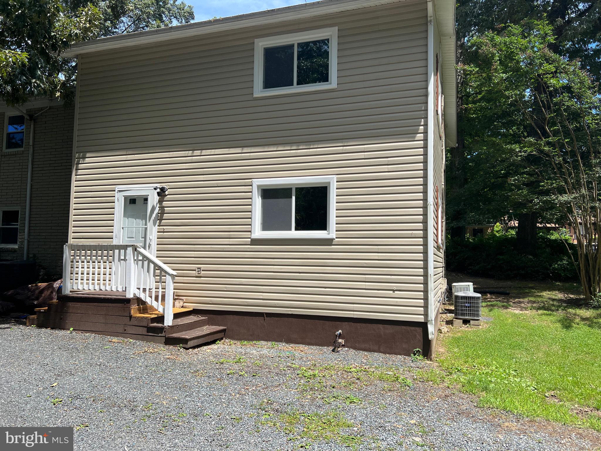 a view of a house with a yard and garage
