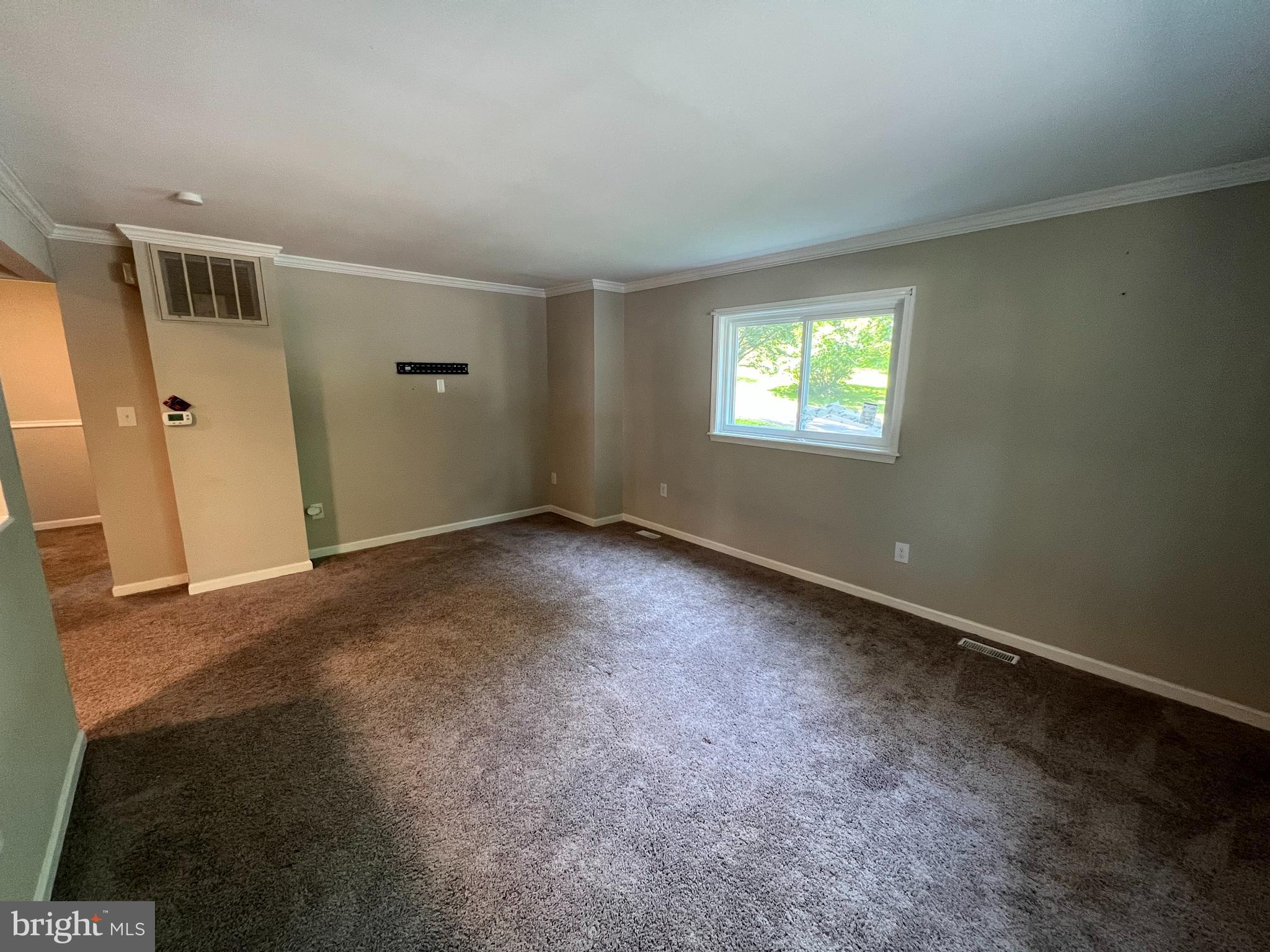 18402 Cedar Drive, Unit A Triangle, VA 22172 - Photo 5 of 9 an empty room with windows