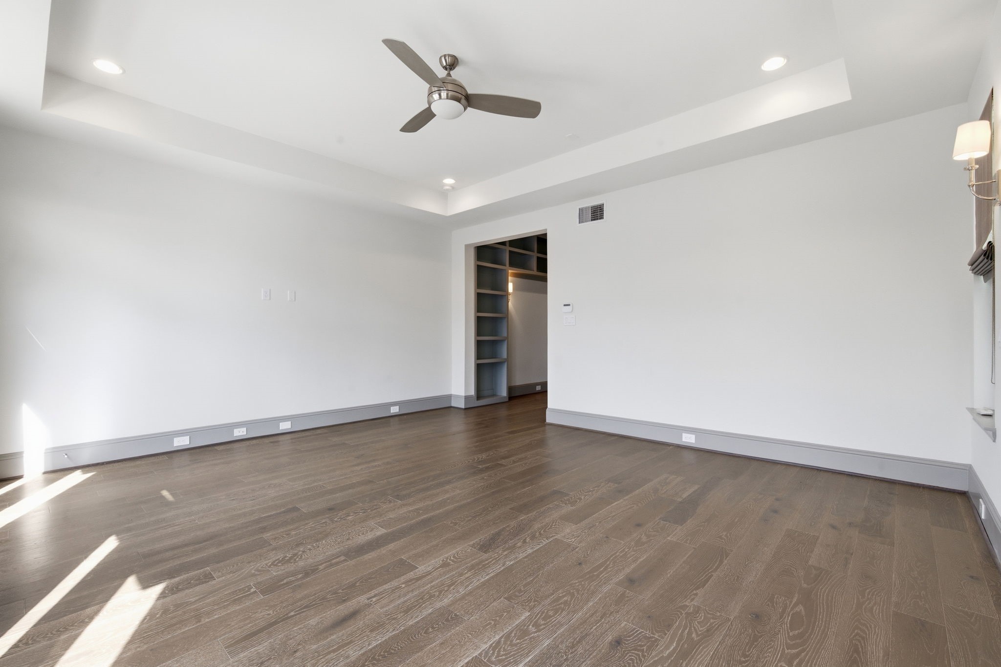 1906 West 25th Street Houston, TX 77008 - Photo 18 of 47 Huge primary bedroom on second floor. Note the tray ceiling, recessed lights, ceiling fan