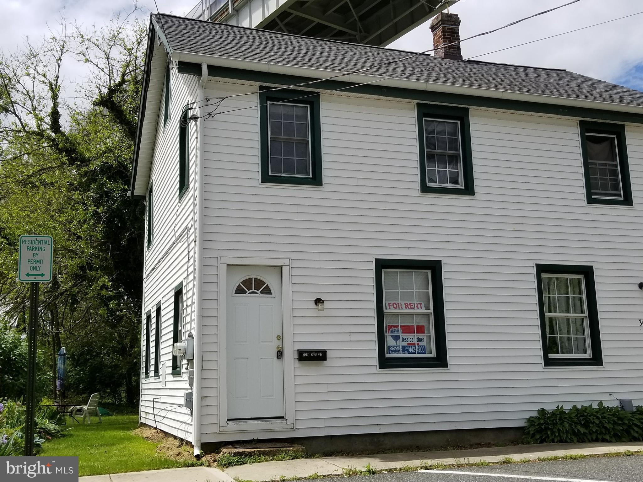 a view of a house with more windows and a yard