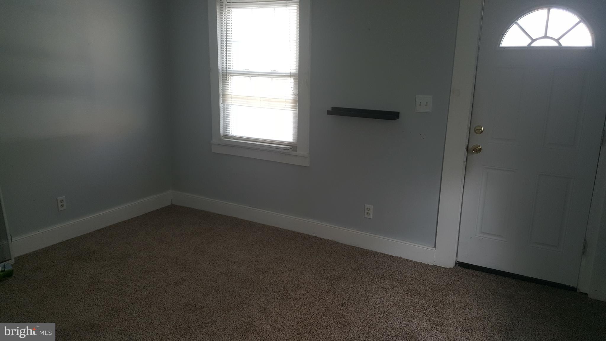 302 3rd Street Chesapeake City, MD 21915 - Photo 2 of 9 an empty room with a window