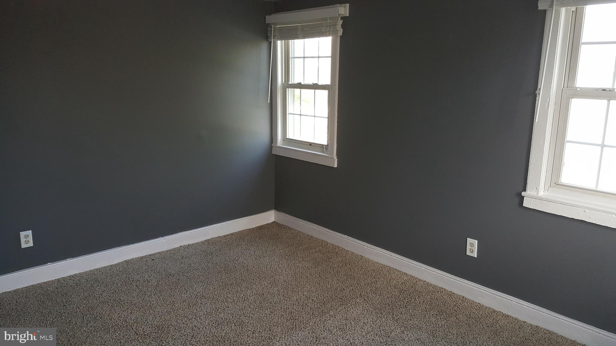 302 3rd Street Chesapeake City, MD 21915 - Photo 5 of 9 an empty room with windows
