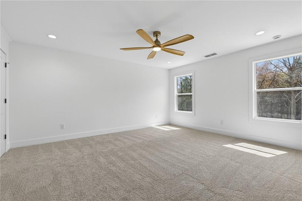 88 Carolyn Path Rockmart, GA 30153 - Photo 33 of 73 an empty room with windows and fan