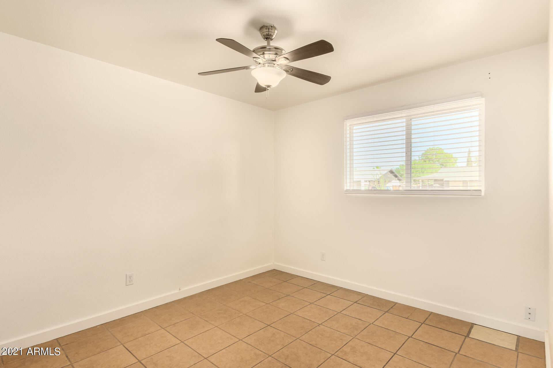 803 West Elna Rae Street Tempe, AZ 85281 - Photo 16 of 28 an empty room with wooden floor and windows