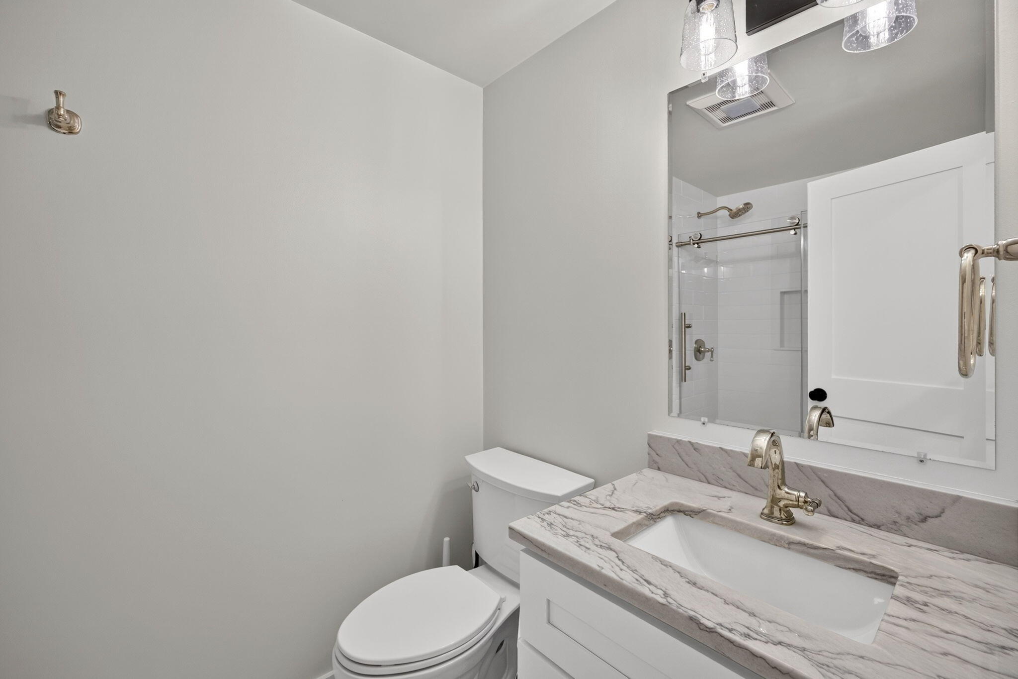 35 Debs Hill Road, Unit 35 Yarmouth Port, MA 02675 - Photo 16 of 36 a bathroom with a granite countertop sink mirror vanity and toilet