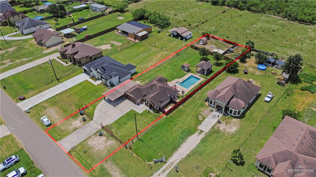15501 East Davis Road Edinburg, TX 78542 - Photo 19 of 20 Aerial perspective showcasing a property with a swimming pool, covered patio, and gazebo