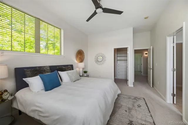 a bedroom with bed and window