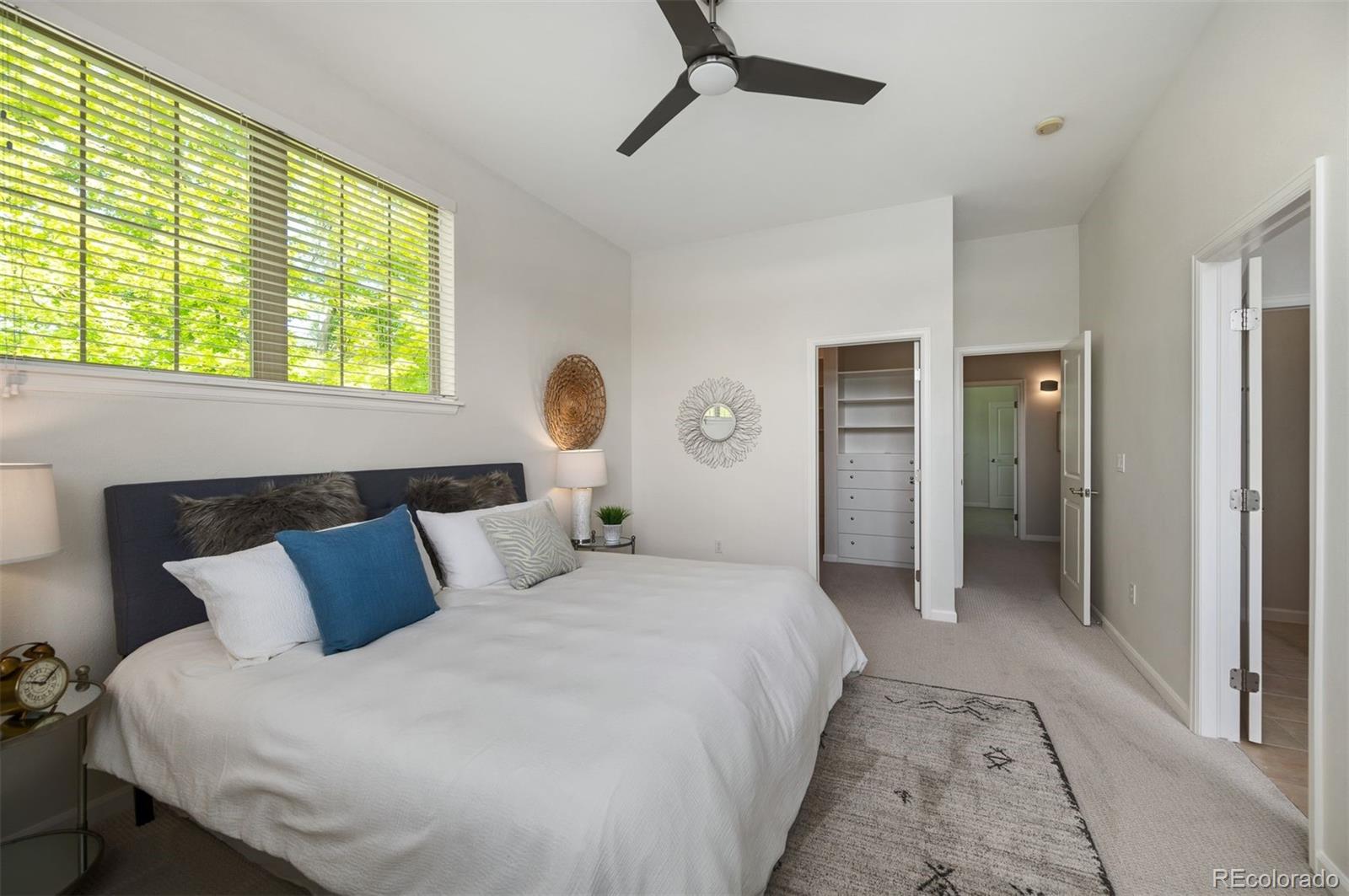 217 Spruce Street, Unit 101 Denver, CO 80230 - Photo 19 of 37 a bedroom with bed and window