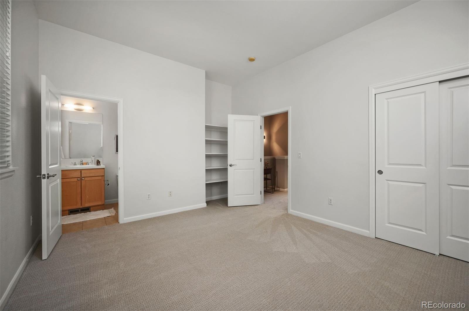 217 Spruce Street, Unit 101 Denver, CO 80230 - Photo 25 of 37 a view of empty room with closet and cabinet