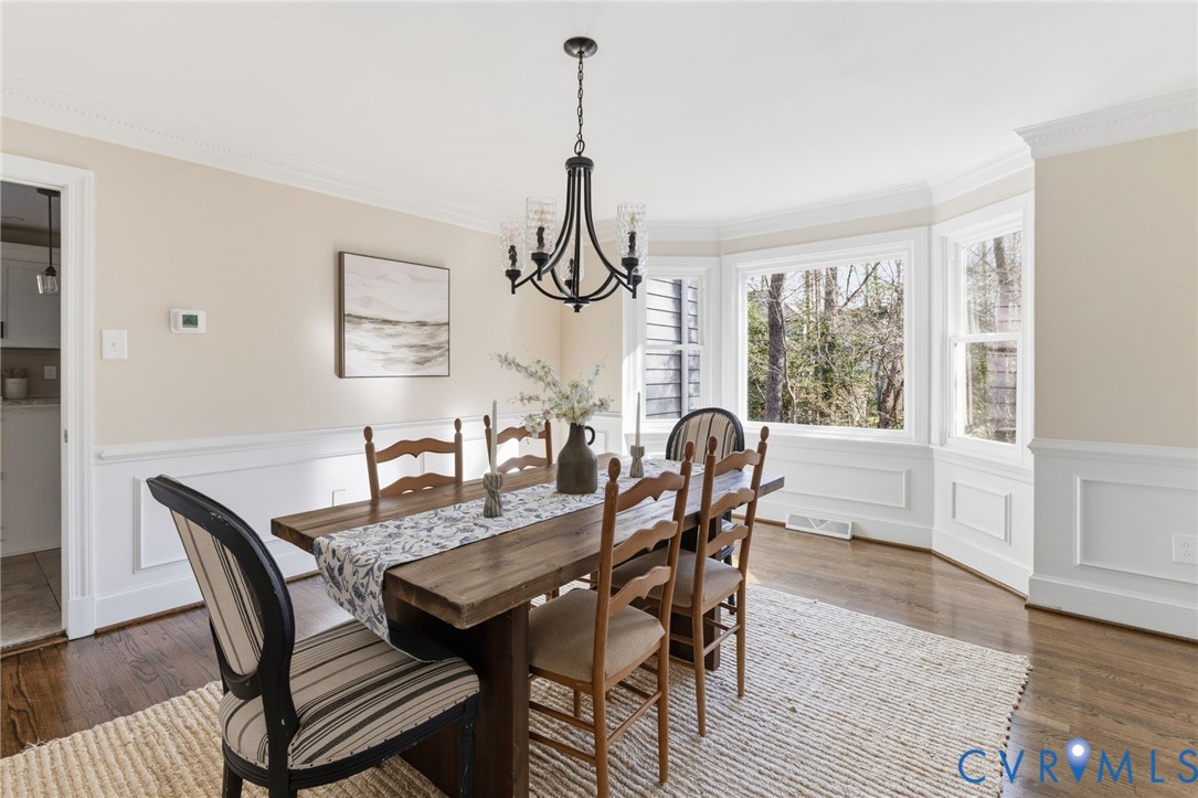 6024 Watch Harbour Road Midlothian, VA 23112 - Photo 22 of 44 a dining room with furniture a chandelier and wooden floor
