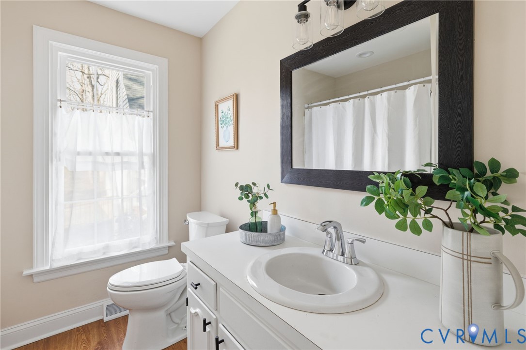 6024 Watch Harbour Road Midlothian, VA 23112 - Photo 27 of 44 a bathroom with a sink a toilet and a mirror