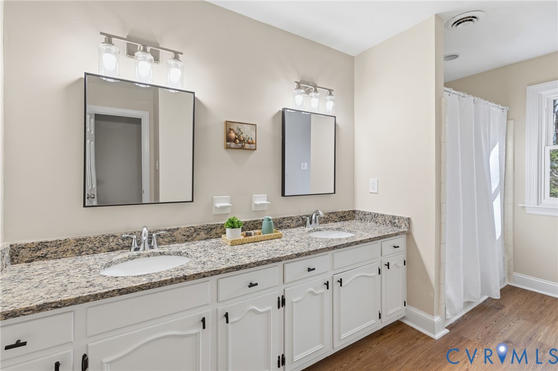 6024 Watch Harbour Road Midlothian, VA 23112 - Photo 41 of 44 a bathroom with a granite countertop double vanity sink and a mirror