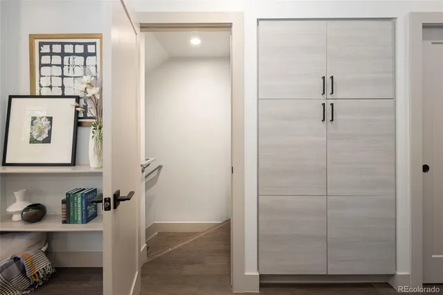 a kitchen with a refrigerator and cabinets